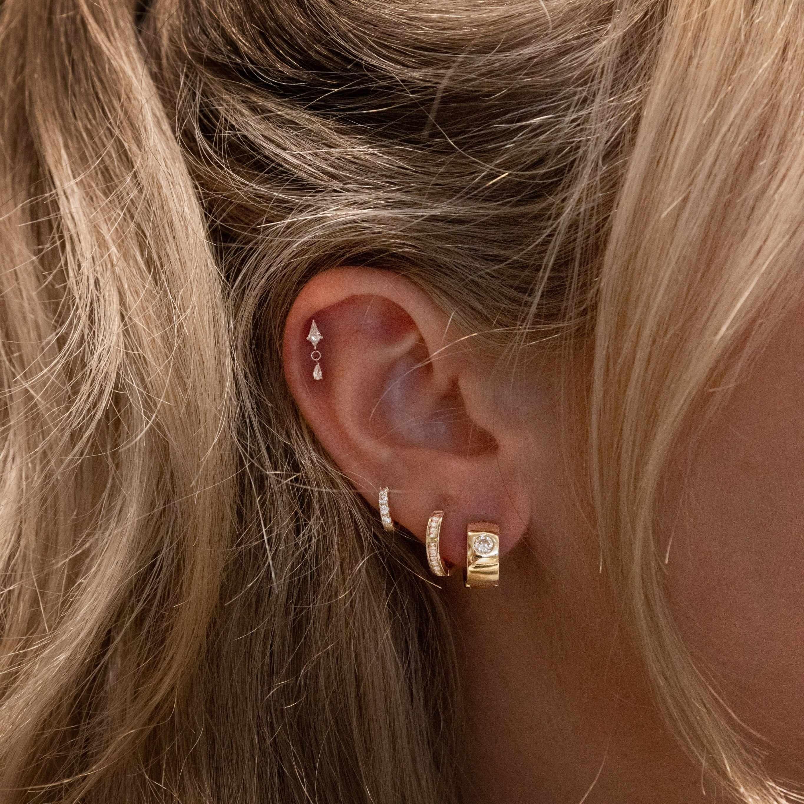 Ania, Avah and Ines crystal huggie earrings styled as the Crystal Glow earring stack