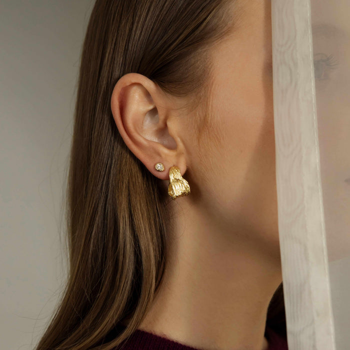 MEZI top 10 statement hoop earrings featuring unique textured and sculptural hoop designs
