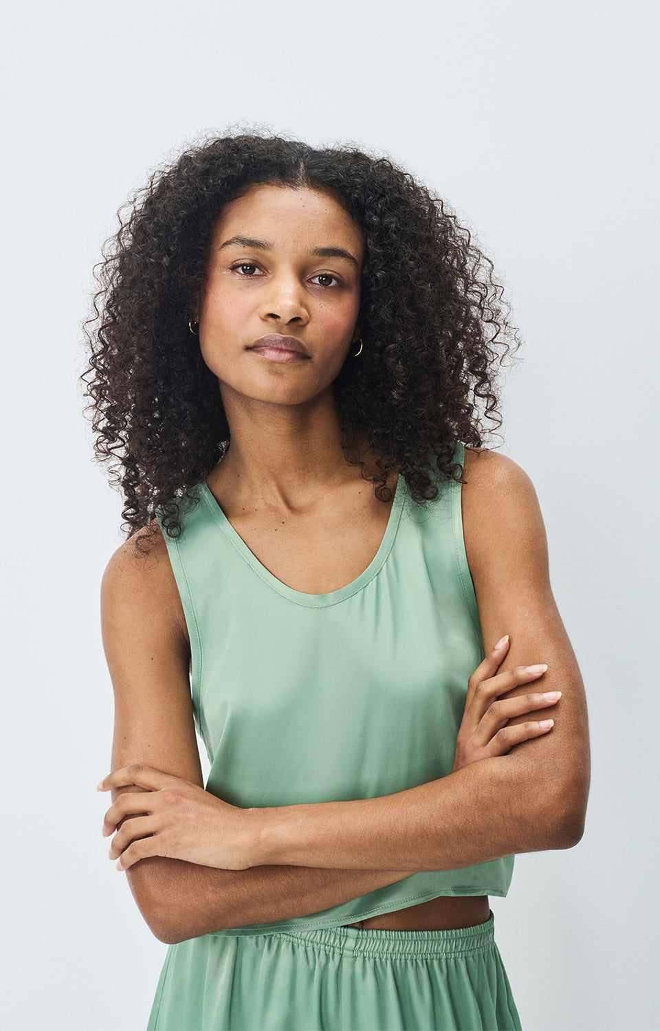 Front view of American Vintage G-UNY07B viscose cami in sage green, soft and lightweight with fluid drape, available at MEZI Australia.