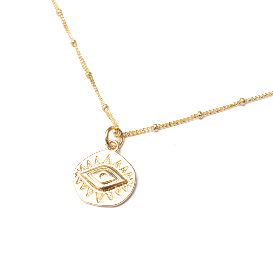Evil eye gold disc pendant