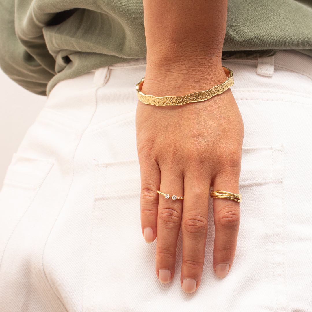 Noma cubic zirconia gold eyelet ring | MEZI