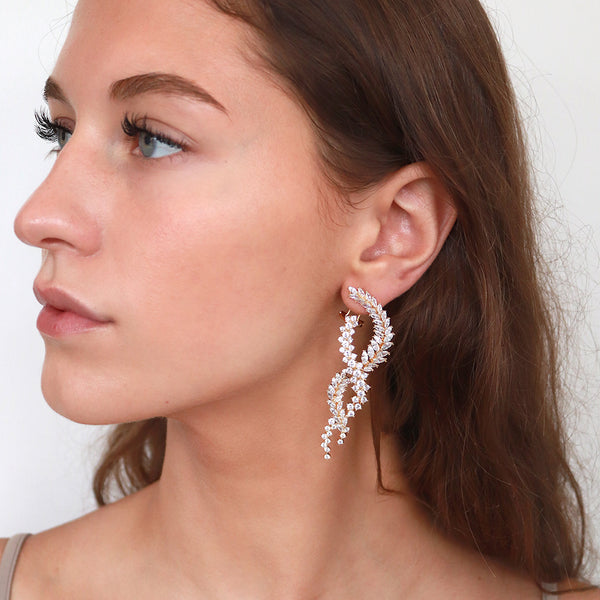 Nisha gold crystal twist drop earrings